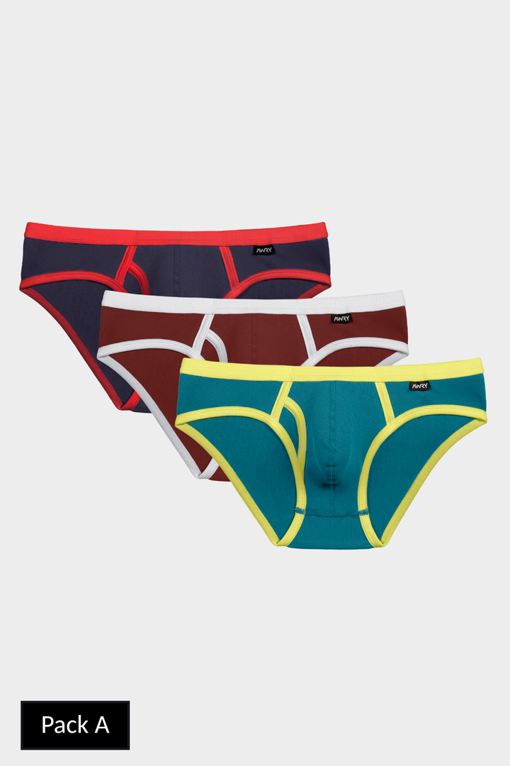 Three briefs in navy with red trim, burgundy with white trim, and teal with yellow trim.