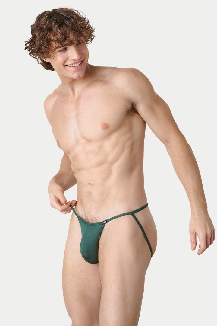 A shirtless man modeling a dark green men&