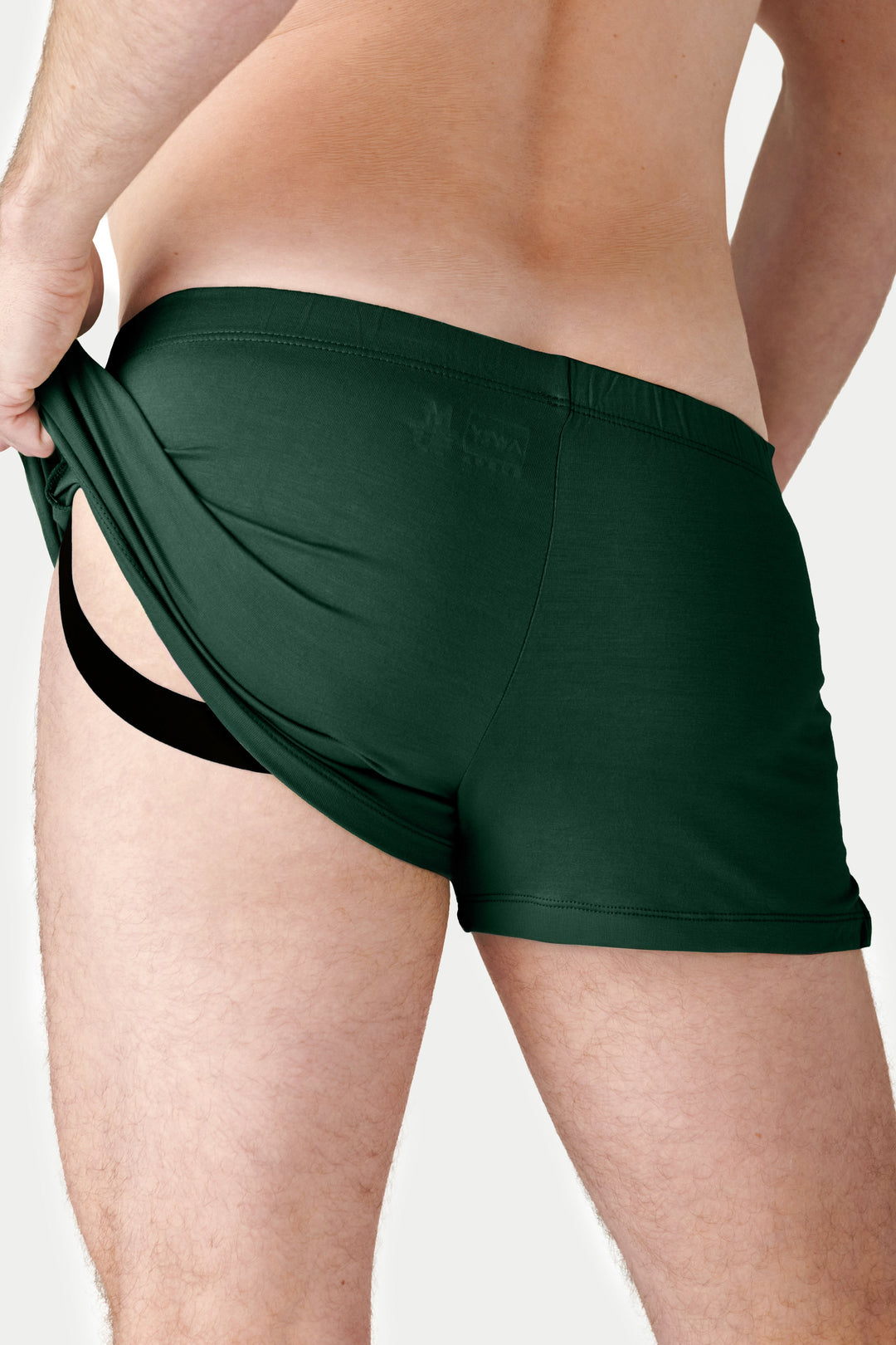 Pine green jock boxers with open fly design shown on model from waist down.