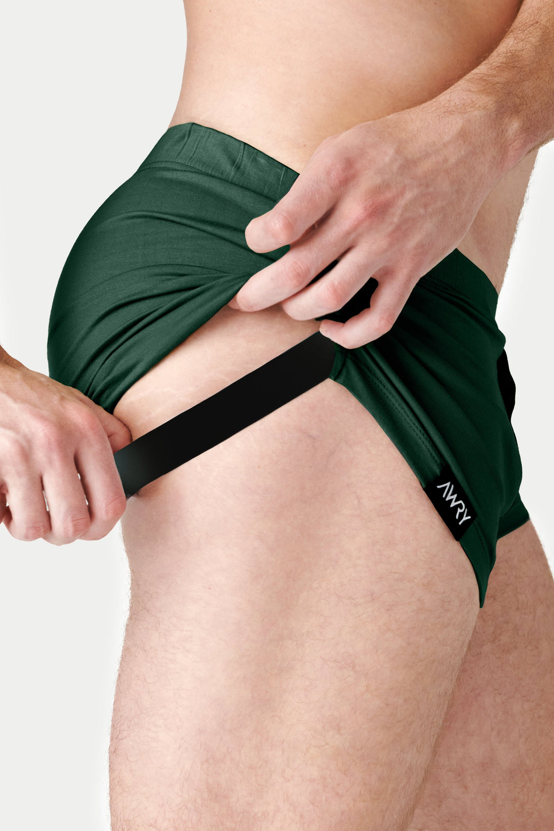 Pine green jock boxers with black waistband and contrast pouch panel on model.
