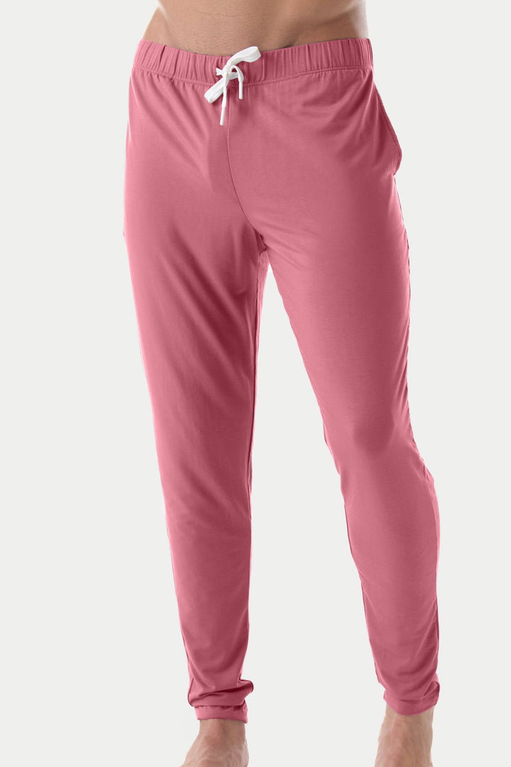 Blush red lounge pants with elastic waistband, white drawstring, and tapered ankles.