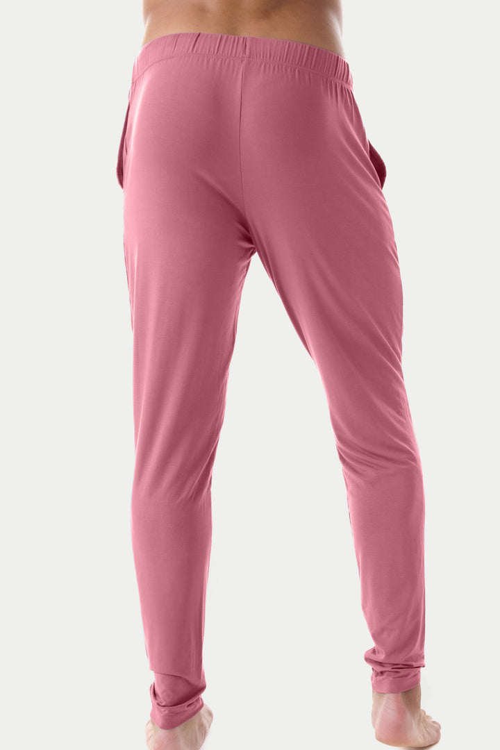 Blush red lounge pants with elastic waistband and cuffed ankles, shown from back view.