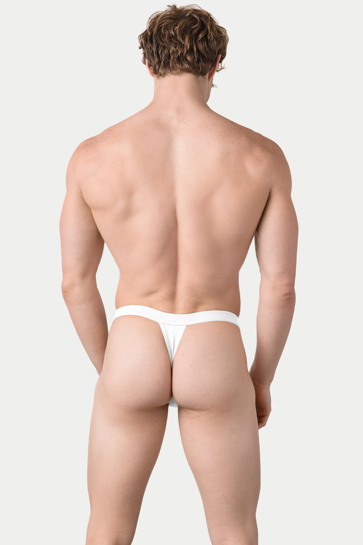 White ribbed thong with minimal coverage, shown from back view on male model.