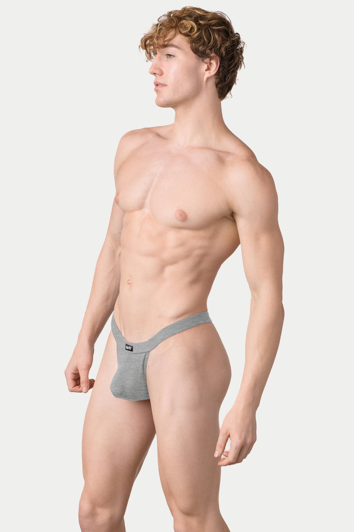 Heather gray ribbed thong with elastic waistband on model shown from side profile.