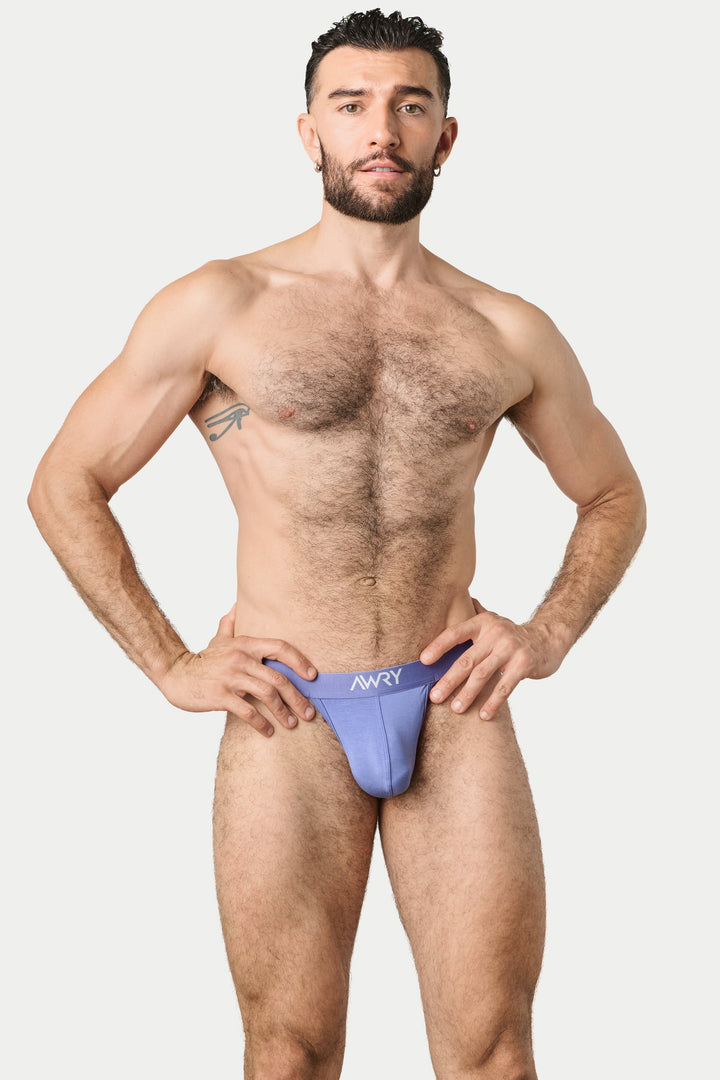 A muscular man modeling a light purple men&
