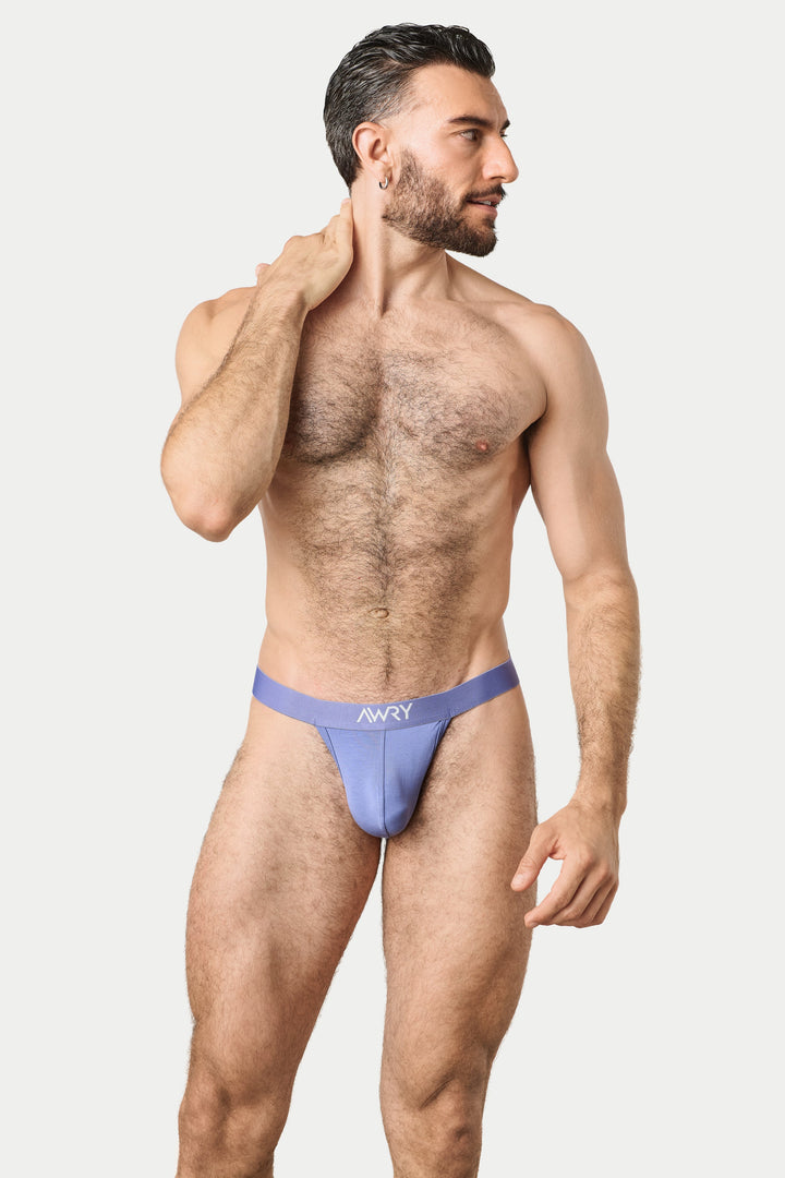 A muscular man modeling a light purple men&